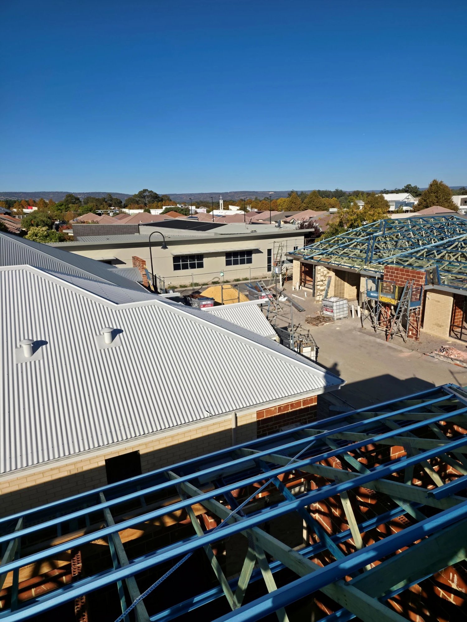 View from the roof over new trusses and neighbouring homes