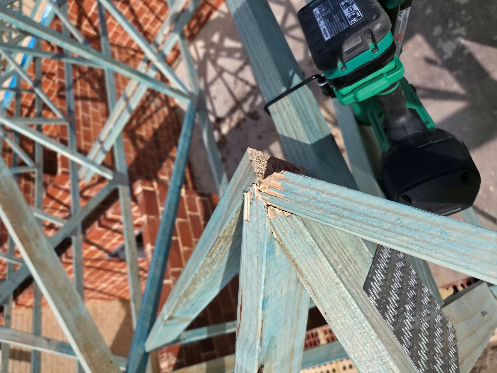 Close-up of a cut rafter and carpenter's drill on site