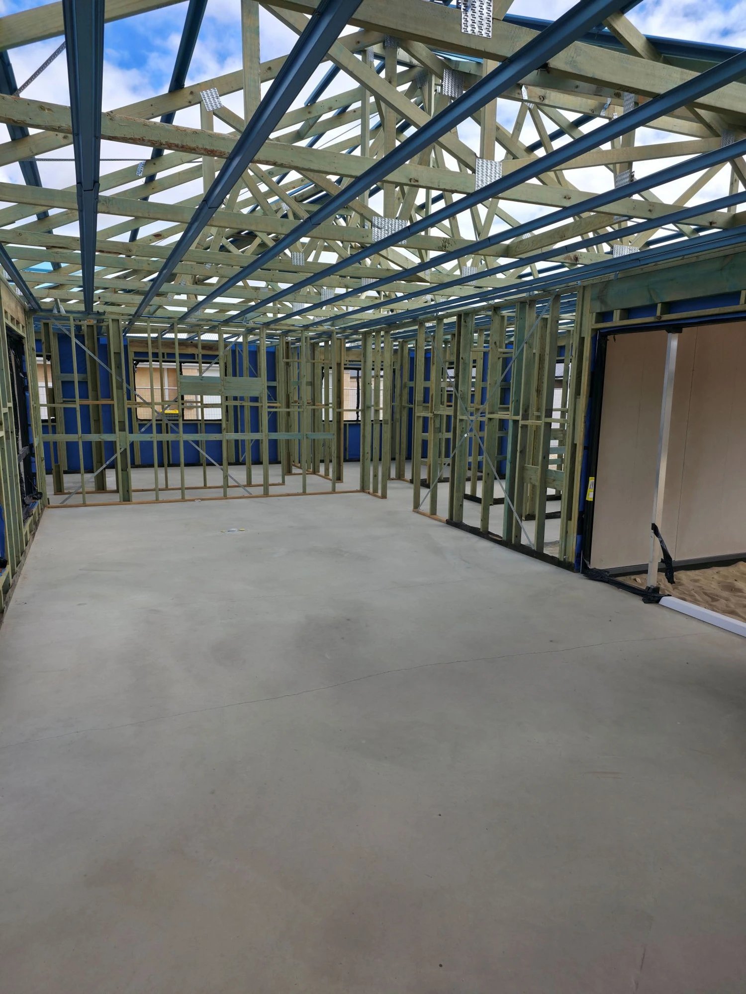 Interior timber wall and roof framing ready for linings
